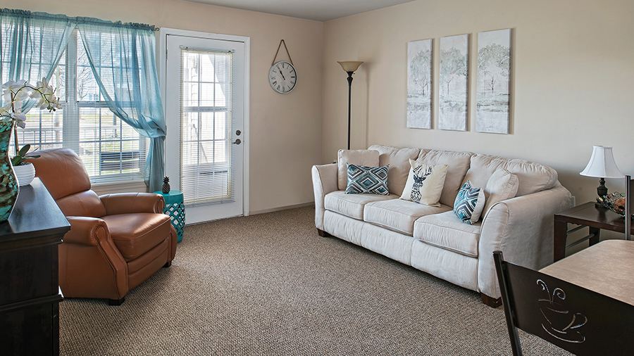 Interior view of a cozy living room with furniture.