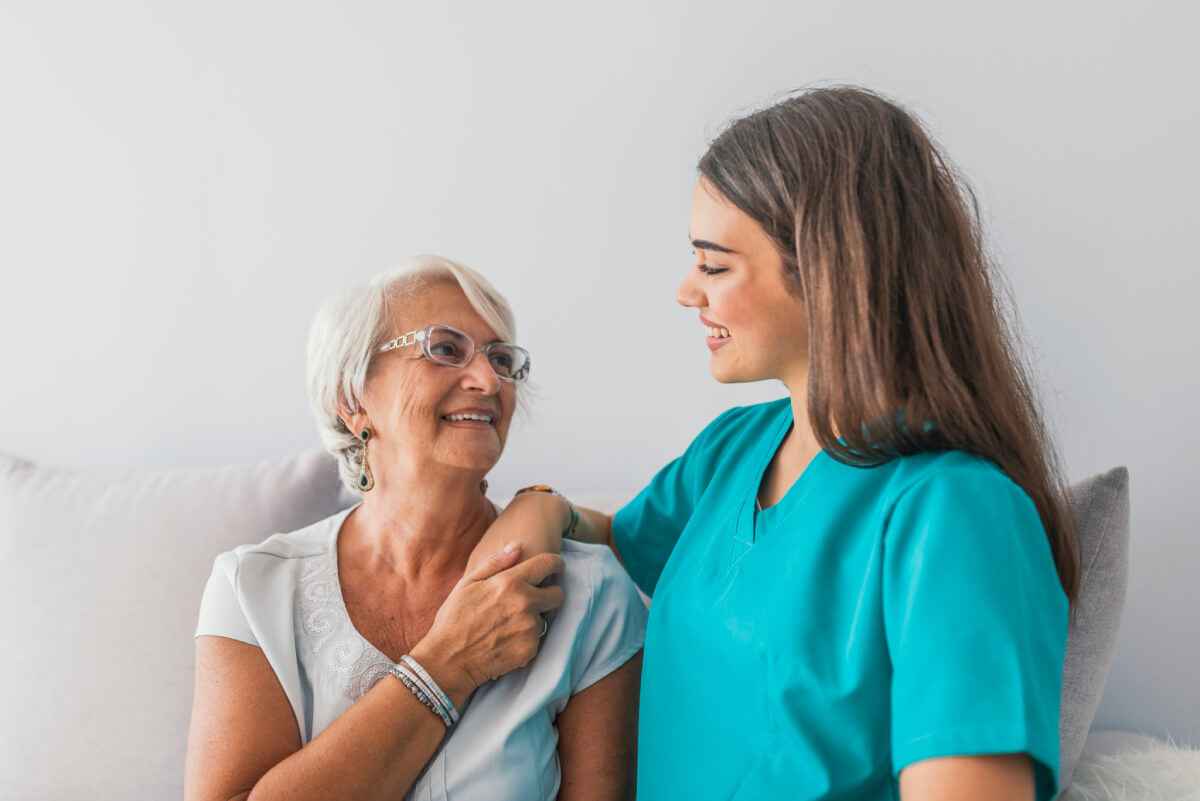 Staff member interacting with a resident in a care facility