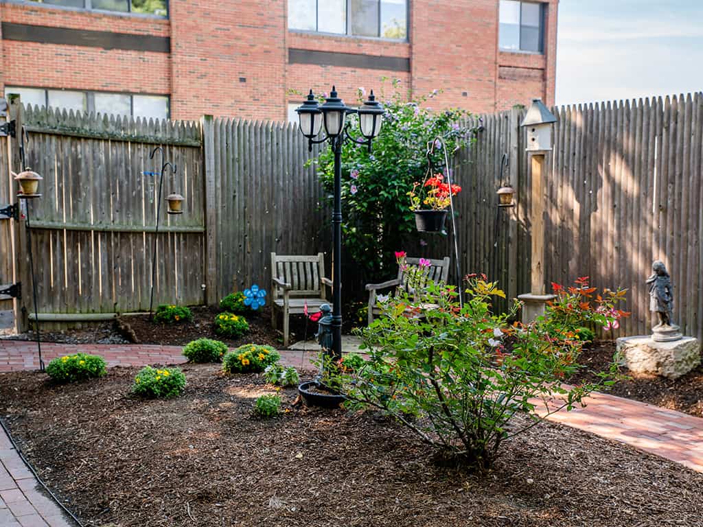 Beautiful outdoor garden area with seating and flowers