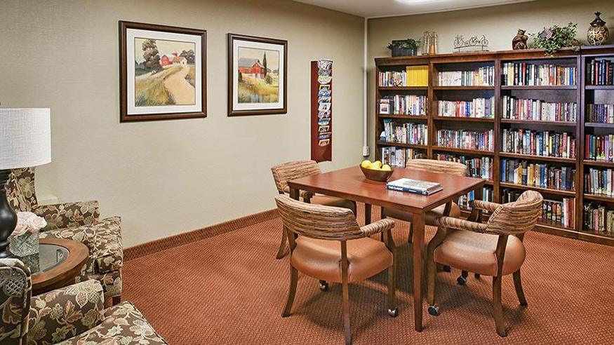Cozy common area with bookshelves and seating