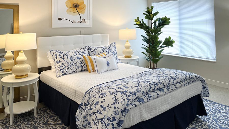 Well-decorated private resident room with flowers and lighting.