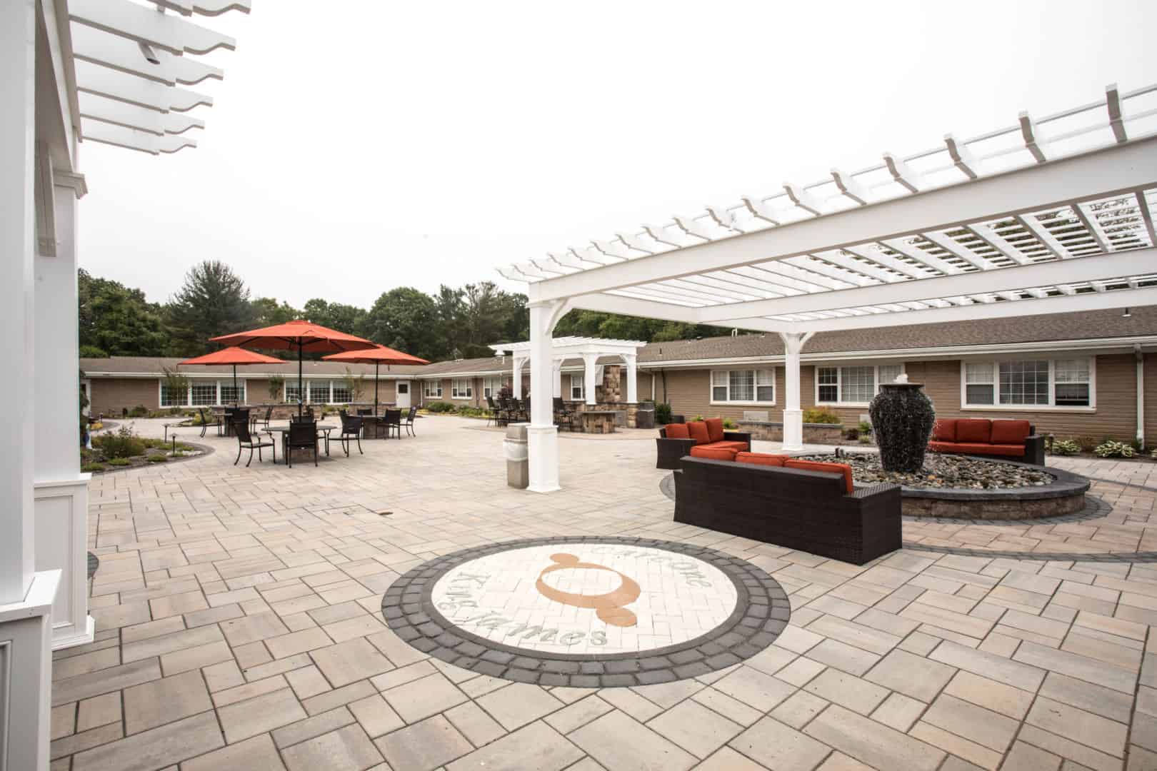 Outdoor patio area with seating and landscaping
