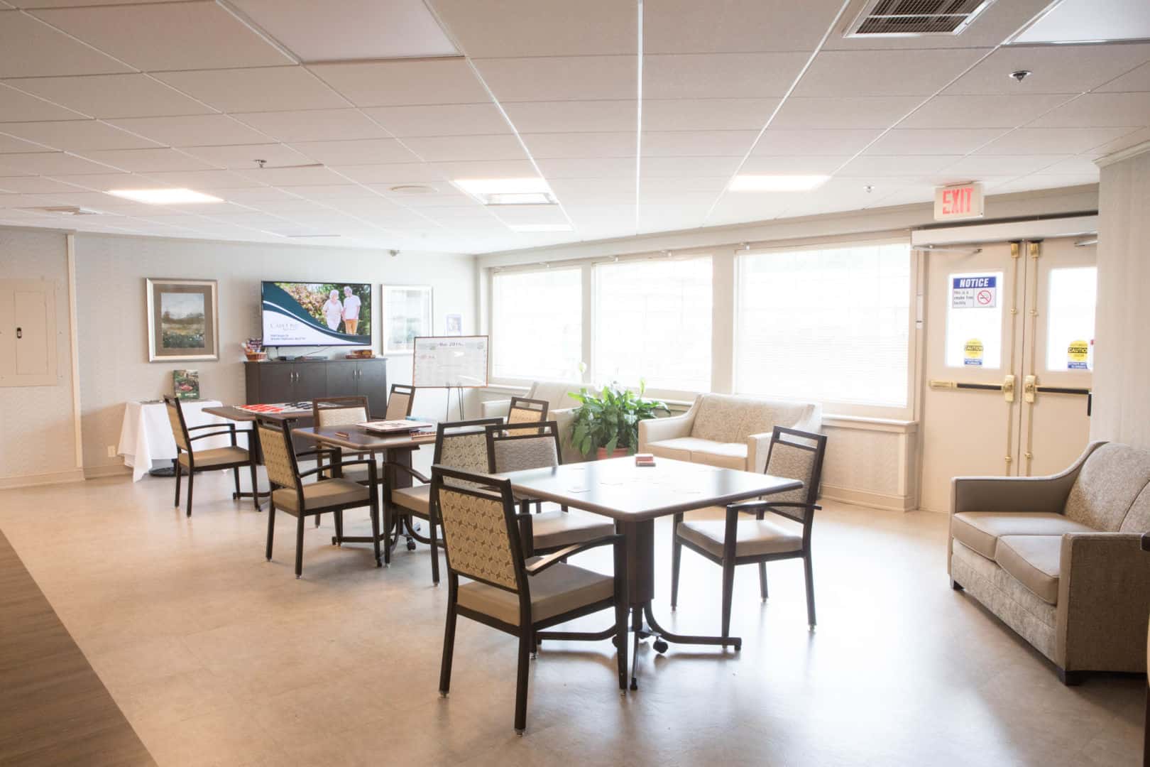 Bright common area with seating and television