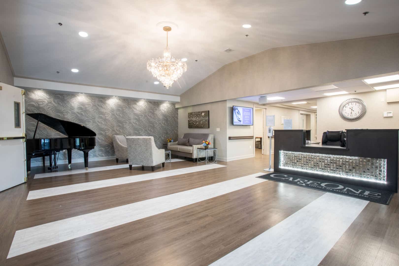 Bright interior lobby with piano and seating area