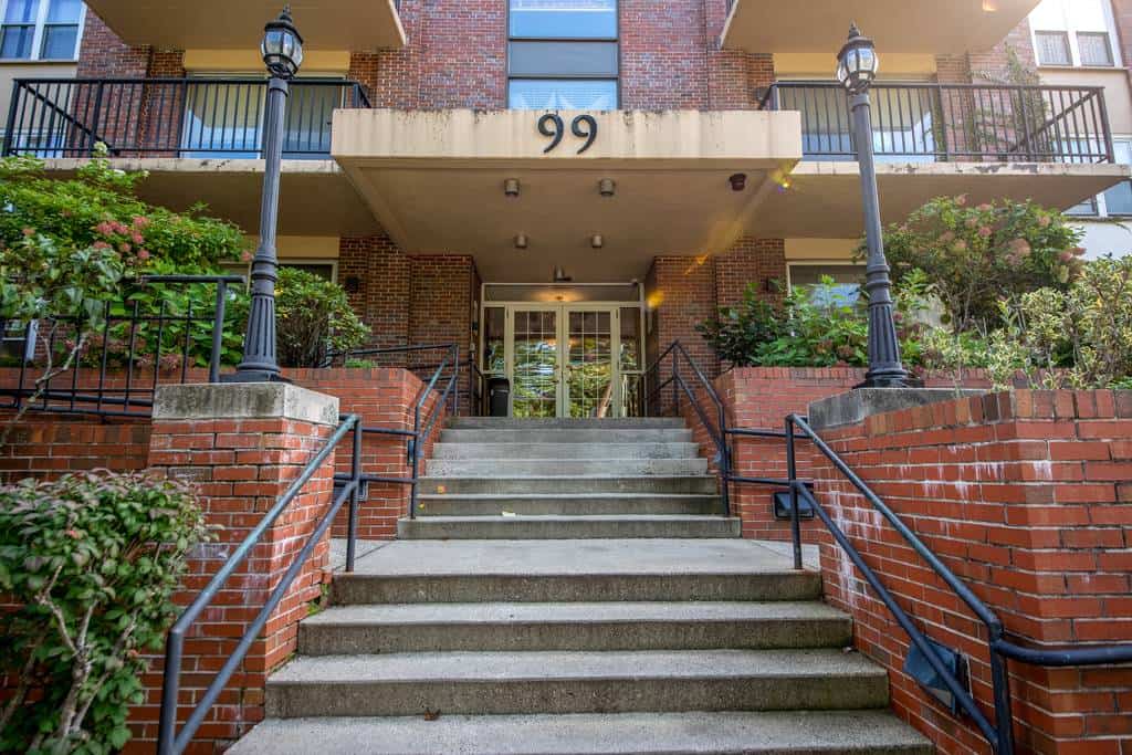 Brick exterior of the facility's entrance with steps