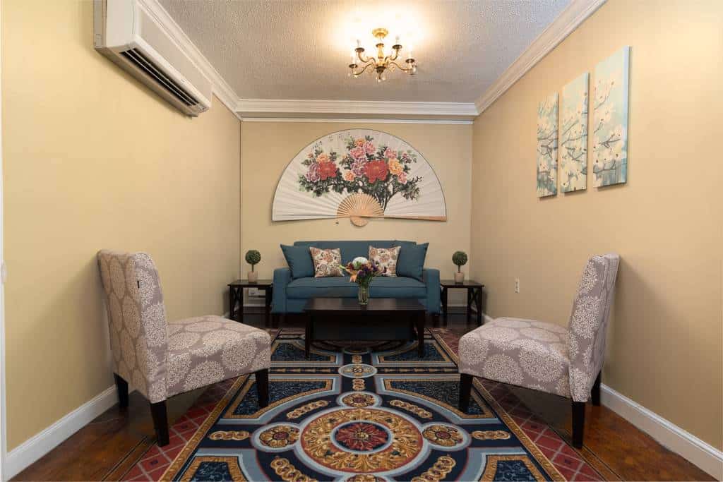 Stylish common area with floral wall decor and seating
