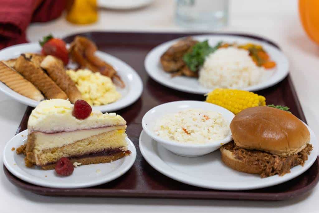 A tray of various meals and desserts