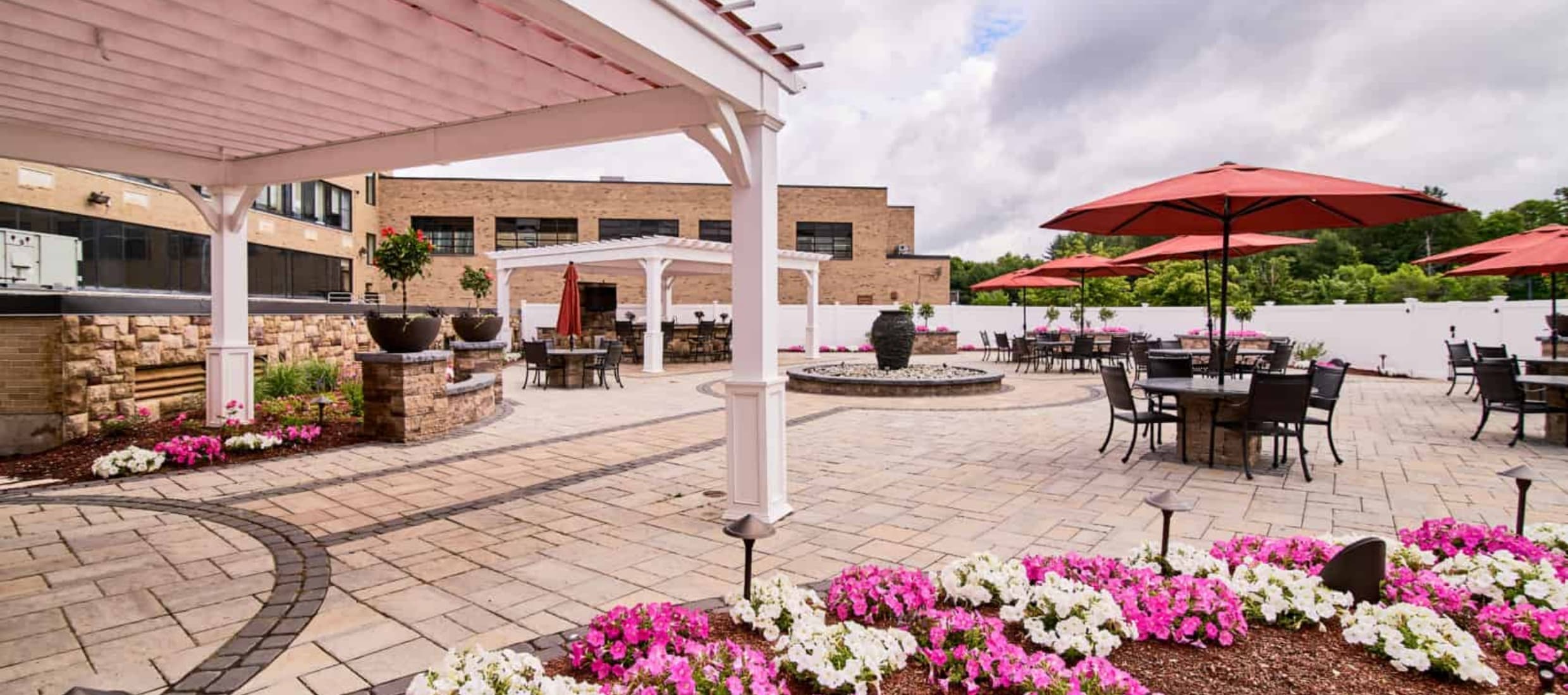 Outdoor patio area with seating and flowers