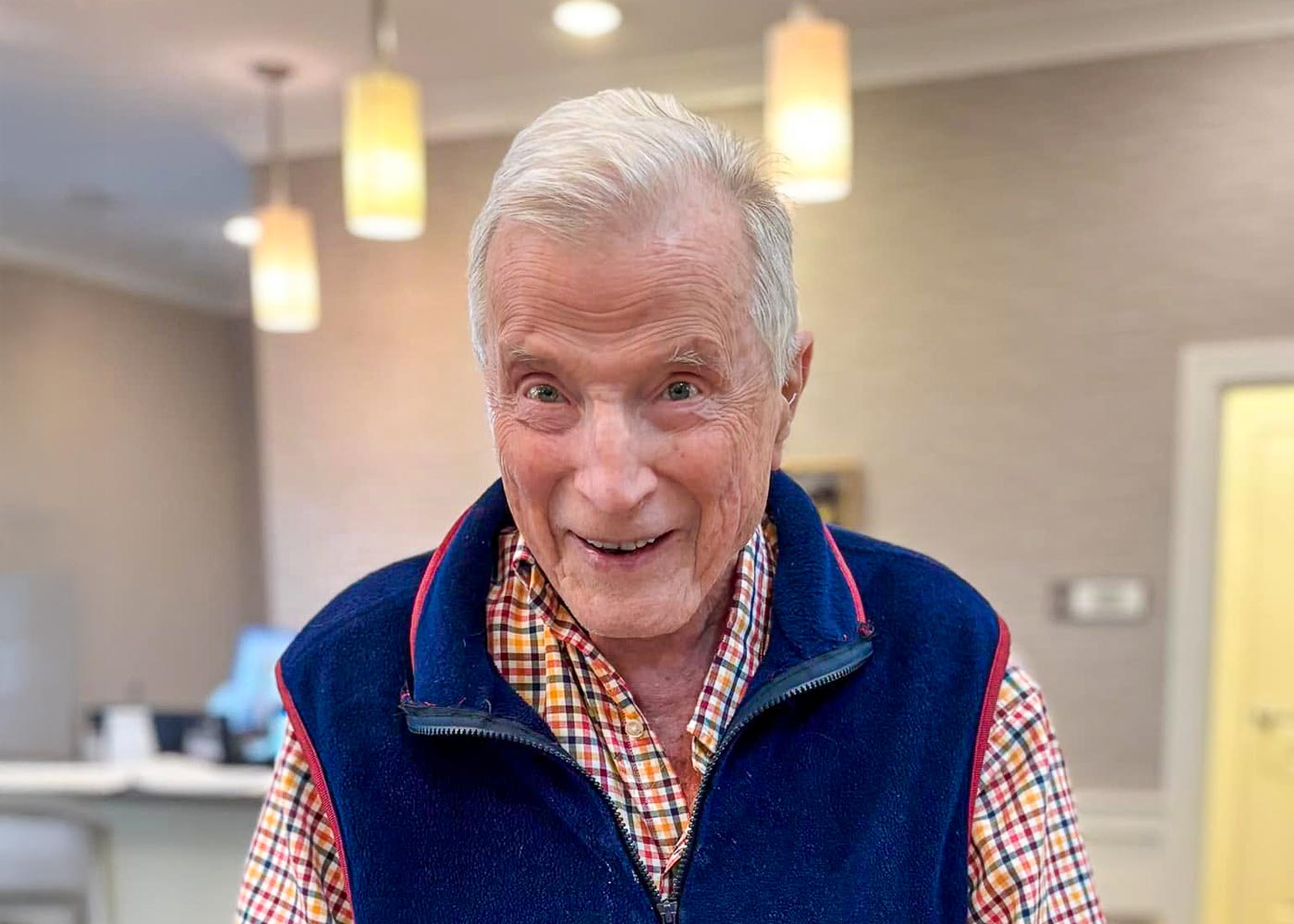 Senior resident smiling in a common area
