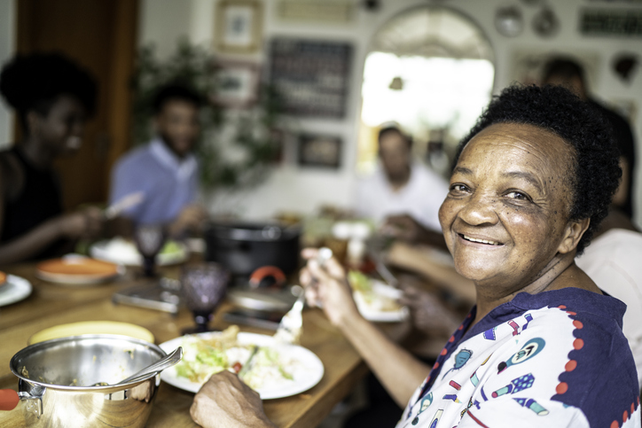 Residents enjoying dinner in a communal dining area