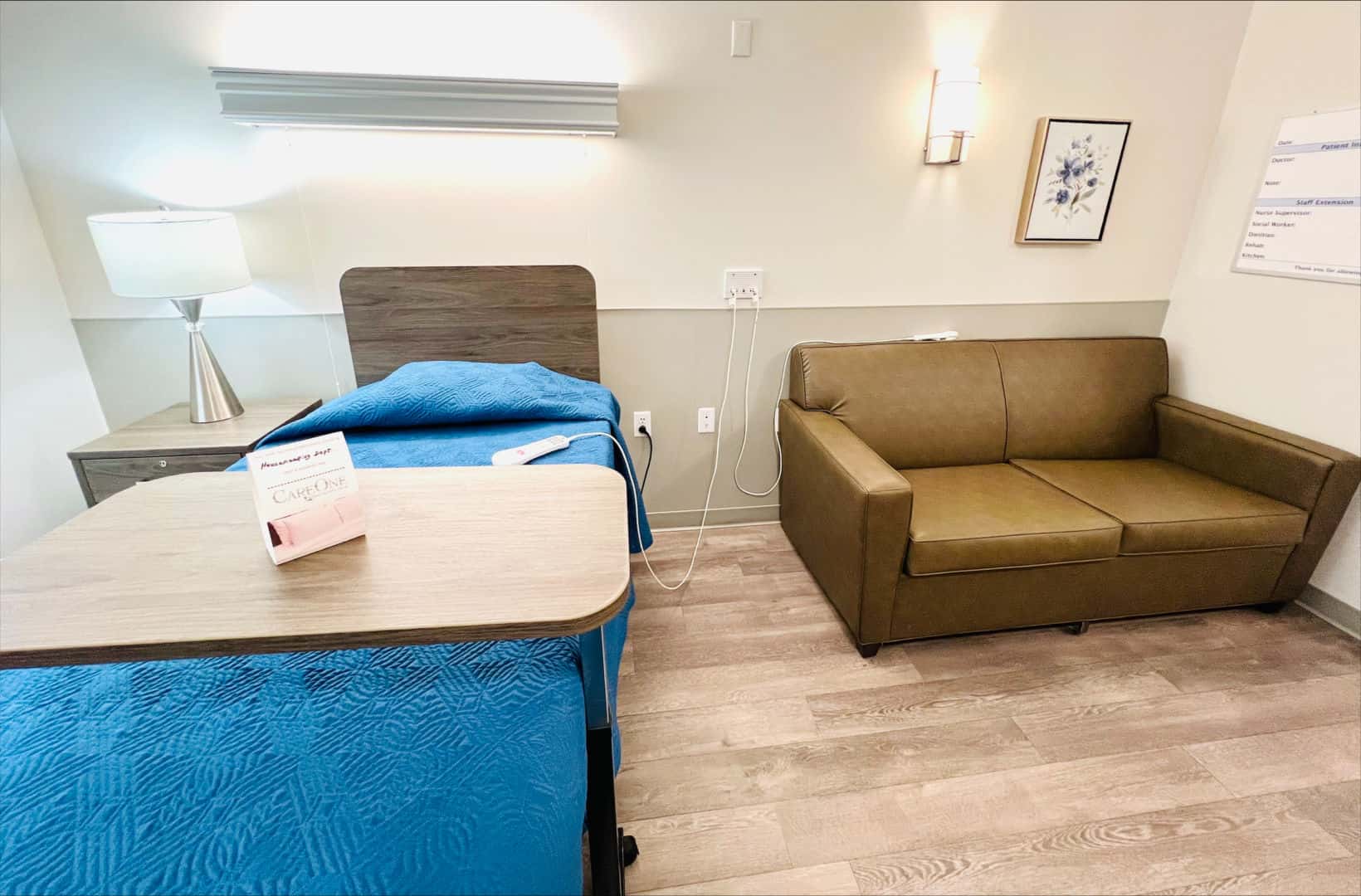 Cozy resident room with a bed and sitting area