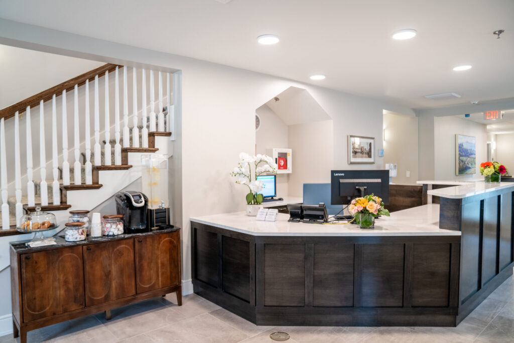 Reception area with a contemporary design and floral arrangement