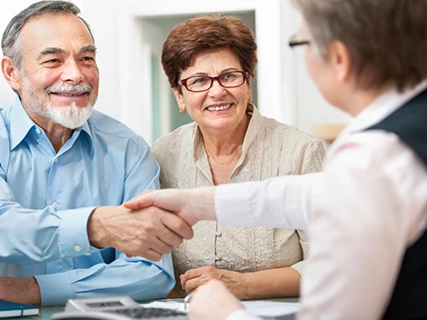 Seniors engaging with staff in a welcoming environment