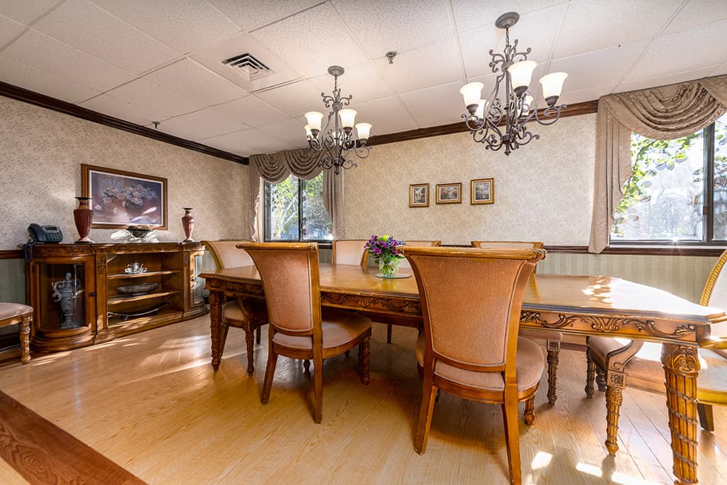 Elegant dining room setup with large table and chairs