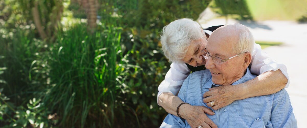 A couple enjoying time together in a lush garden