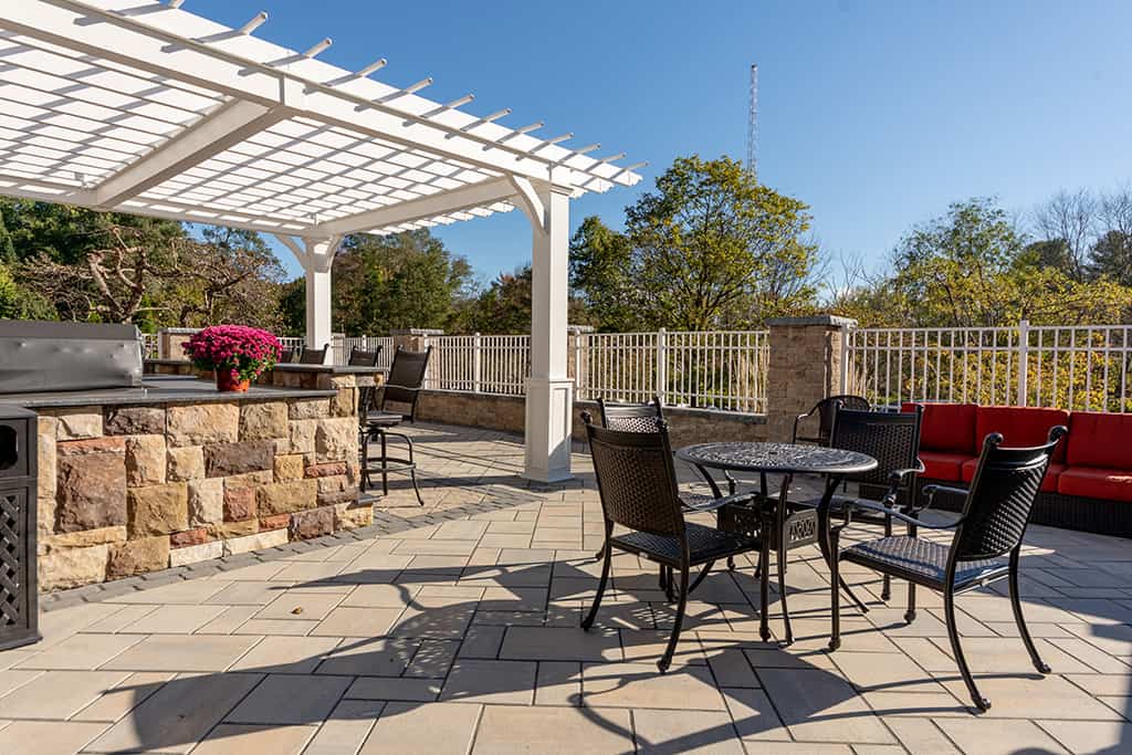 Outdoor patio area with seating and flowers
