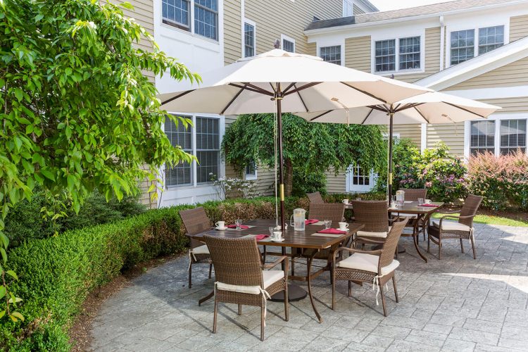 Outdoor dining space with tables and umbrellas
