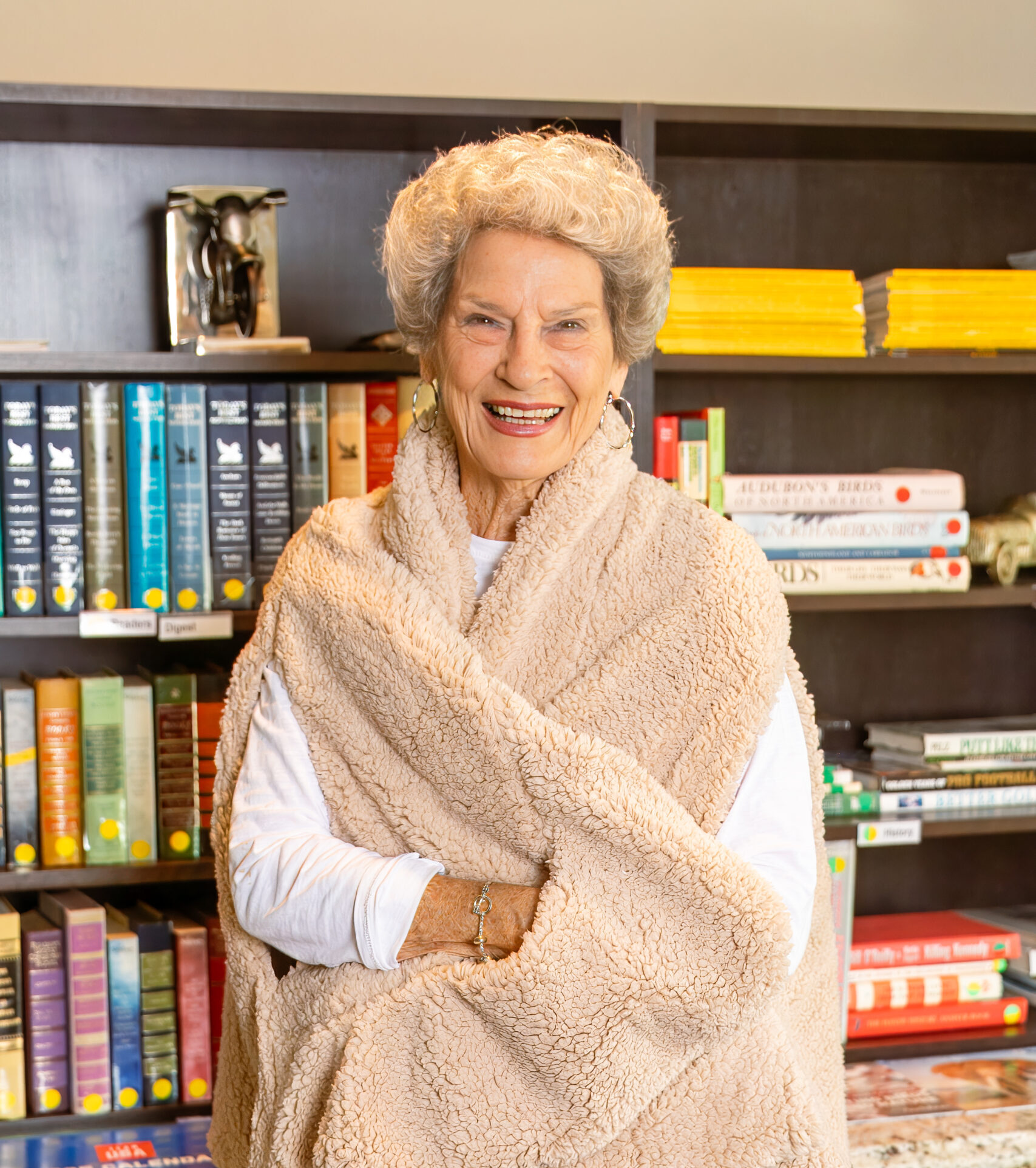 Smiling resident in a cozy library area