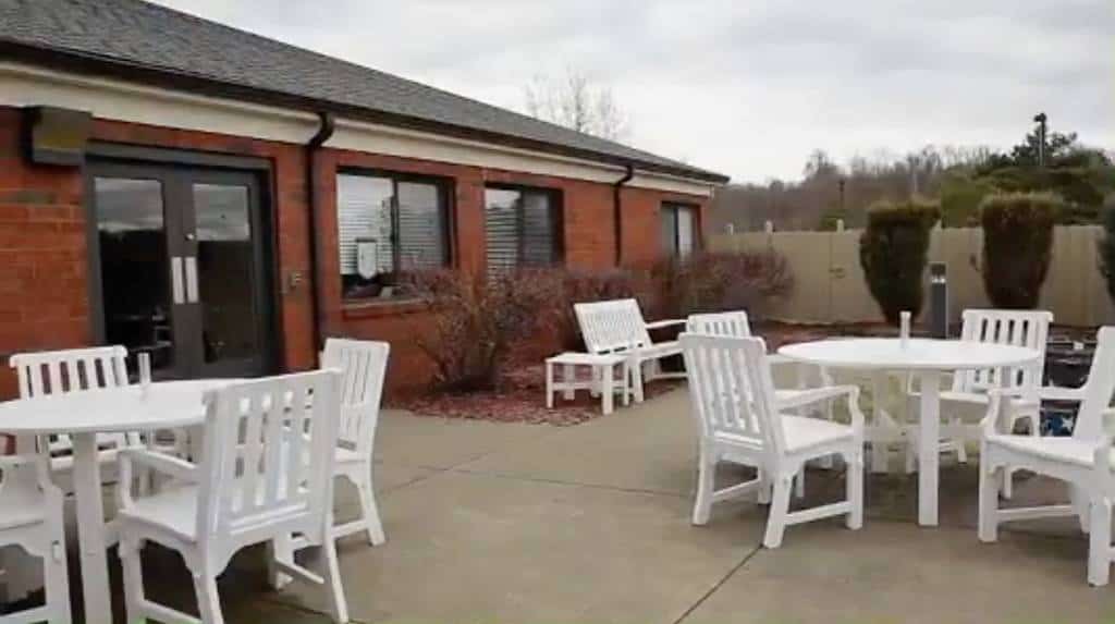 Outdoor seating area with white furniture