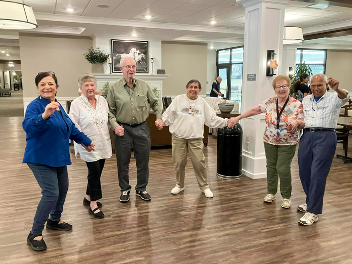 Residents dancing together in a community area