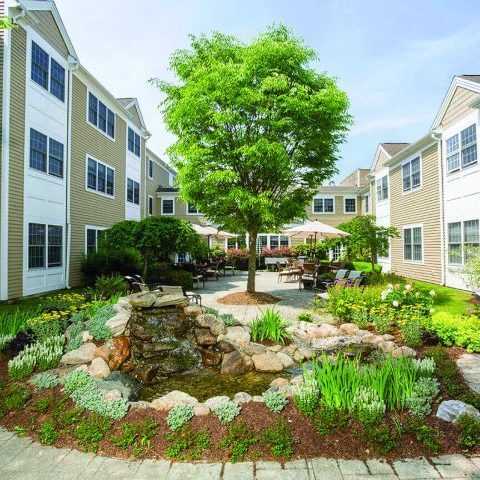 Beautiful outdoor courtyard with a water feature and seating