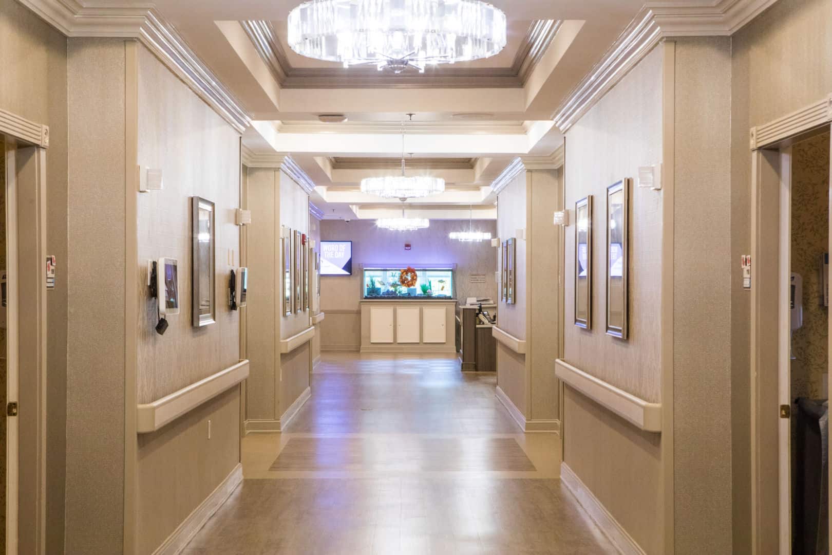 A well-lit interior hallway with decorative lighting