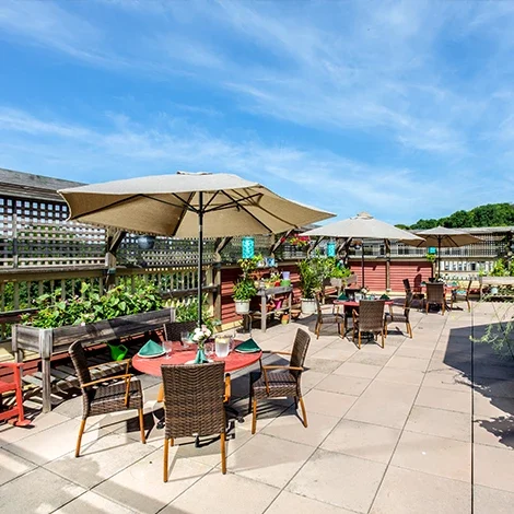 Outdoor patio with tables and umbrellas