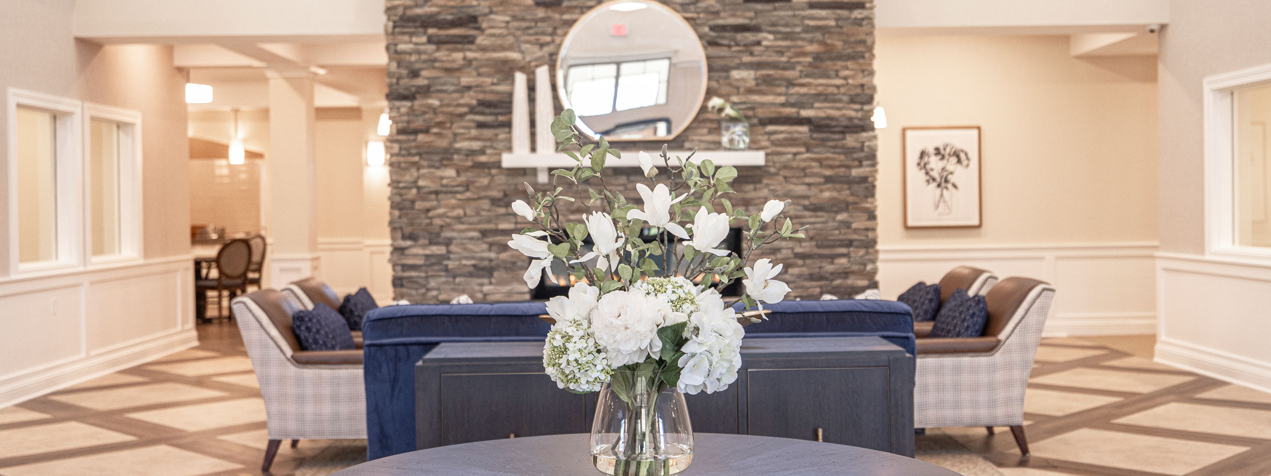 Interior view of a lobby with flowers and seating