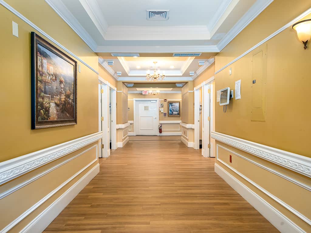 Interior hallway with artwork and illuminated ceiling
