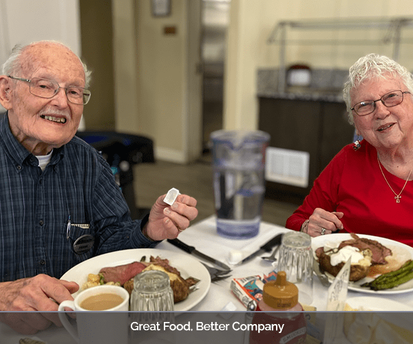 Residents enjoying a meal together in the dining area