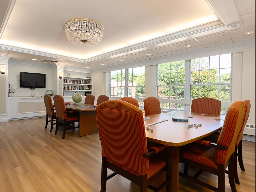 Common area with large windows and table seating