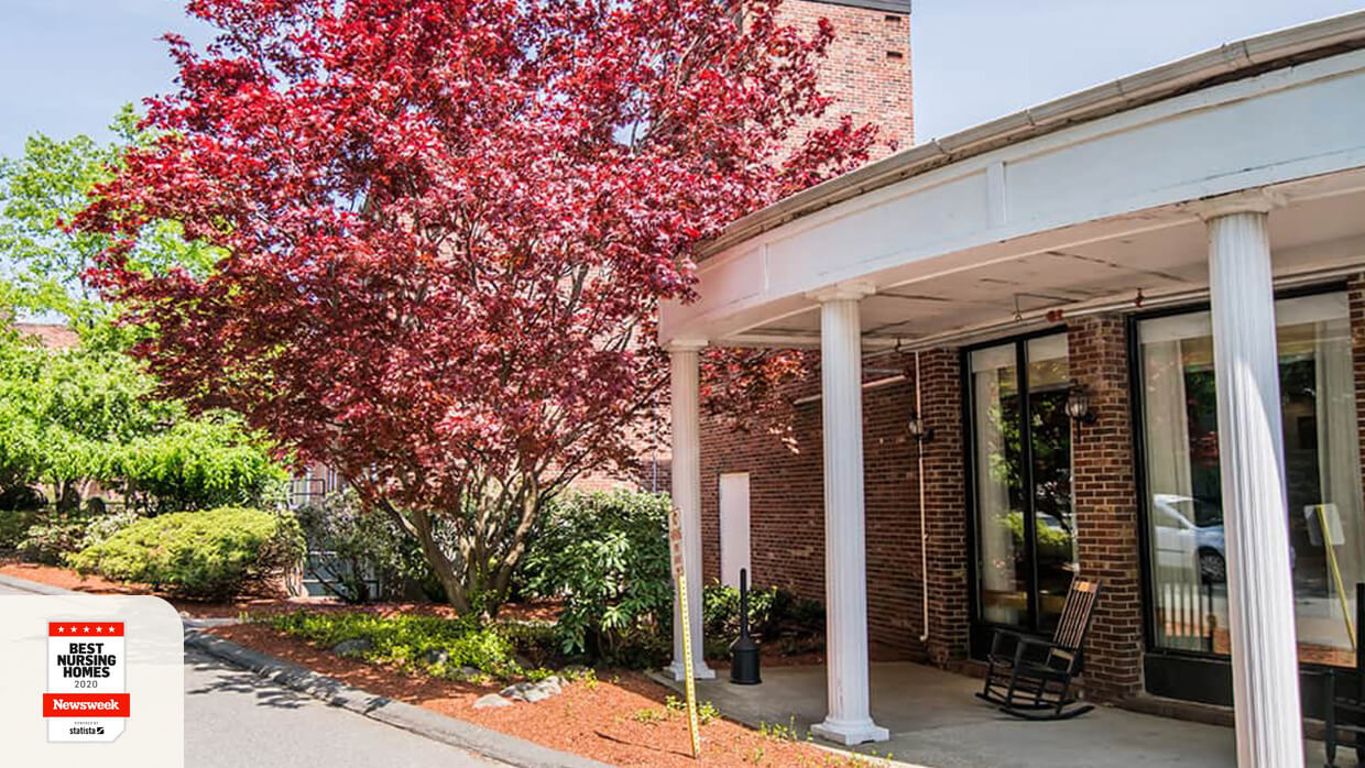 Exterior view of a senior living facility with landscaping