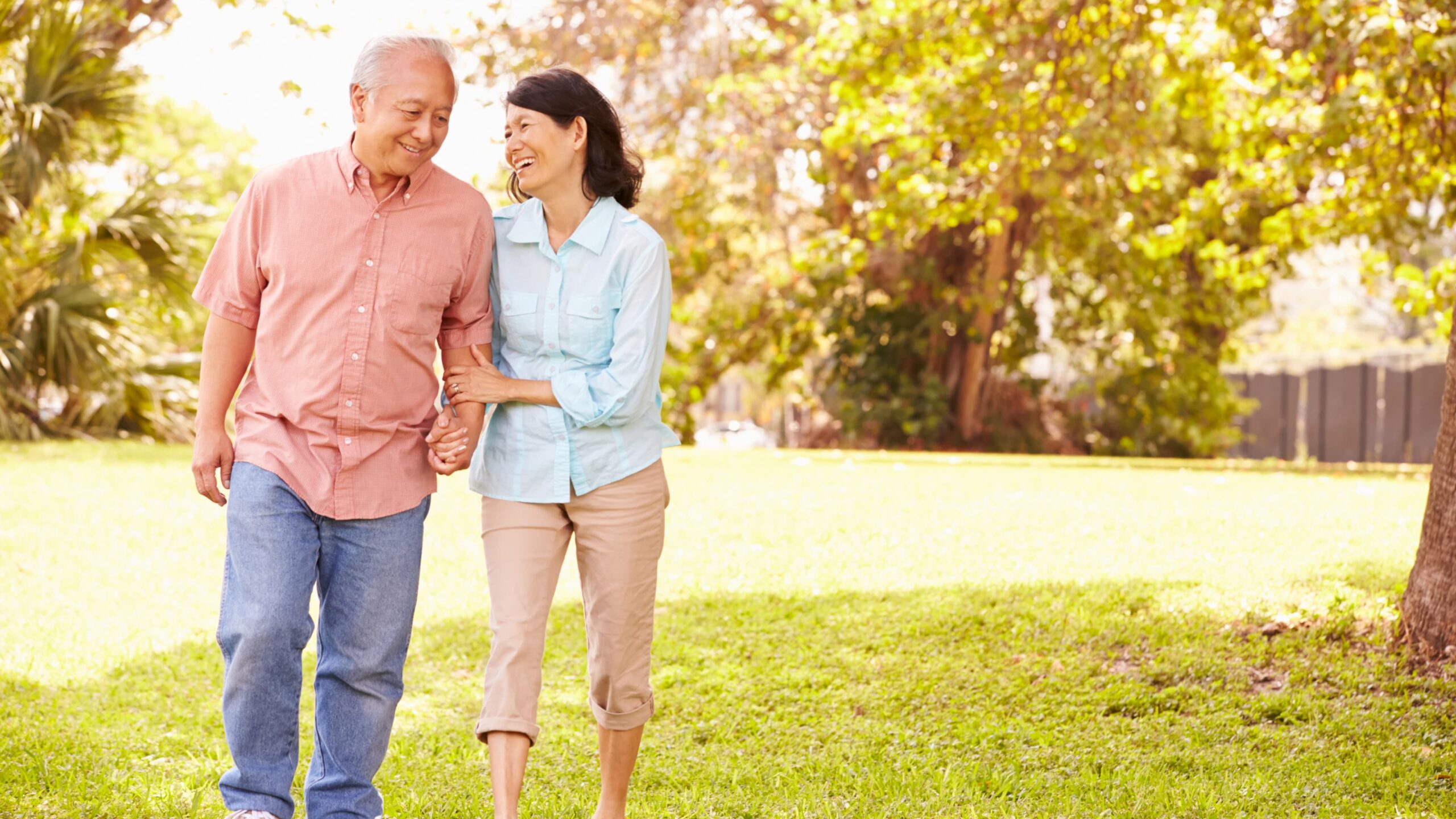 Couple enjoying a walk in a park-like setting