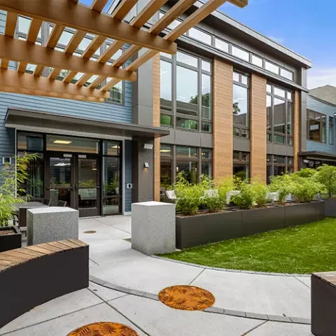 Exterior view of the assisted living facility with landscaped areas