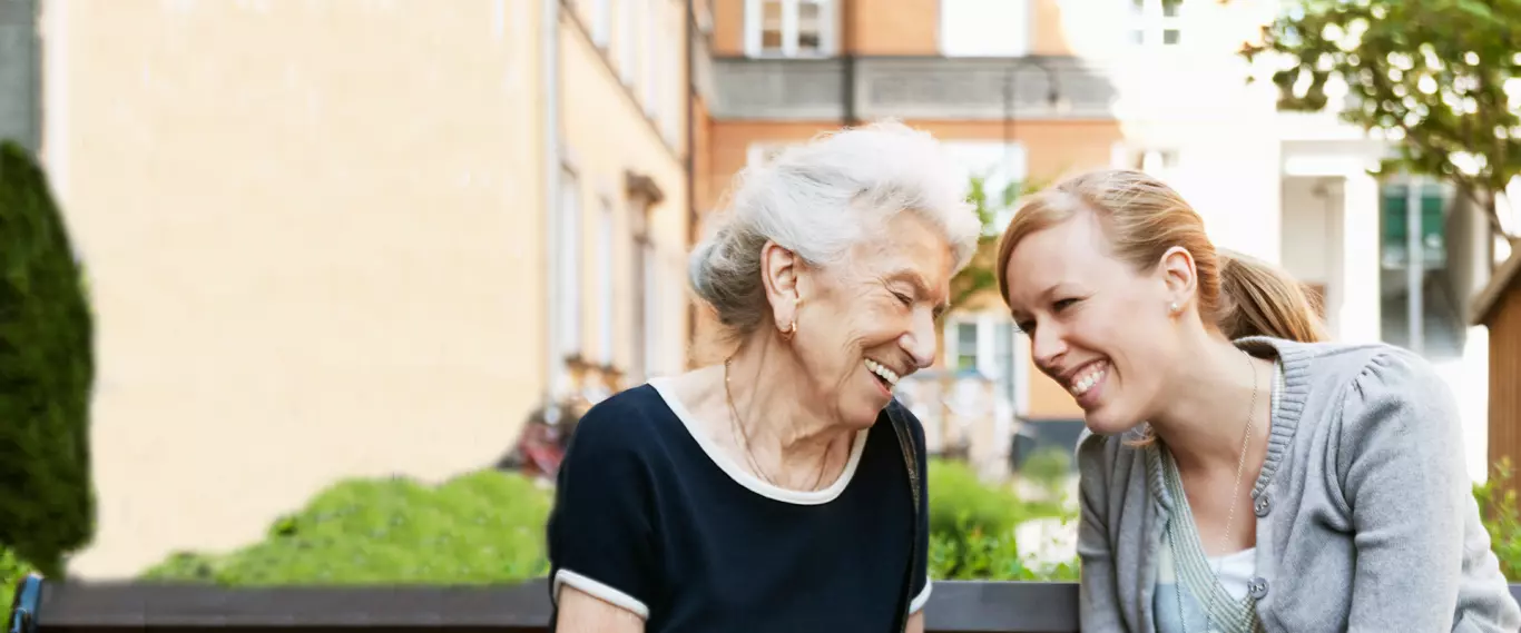 Two women enjoying a moment in the garden