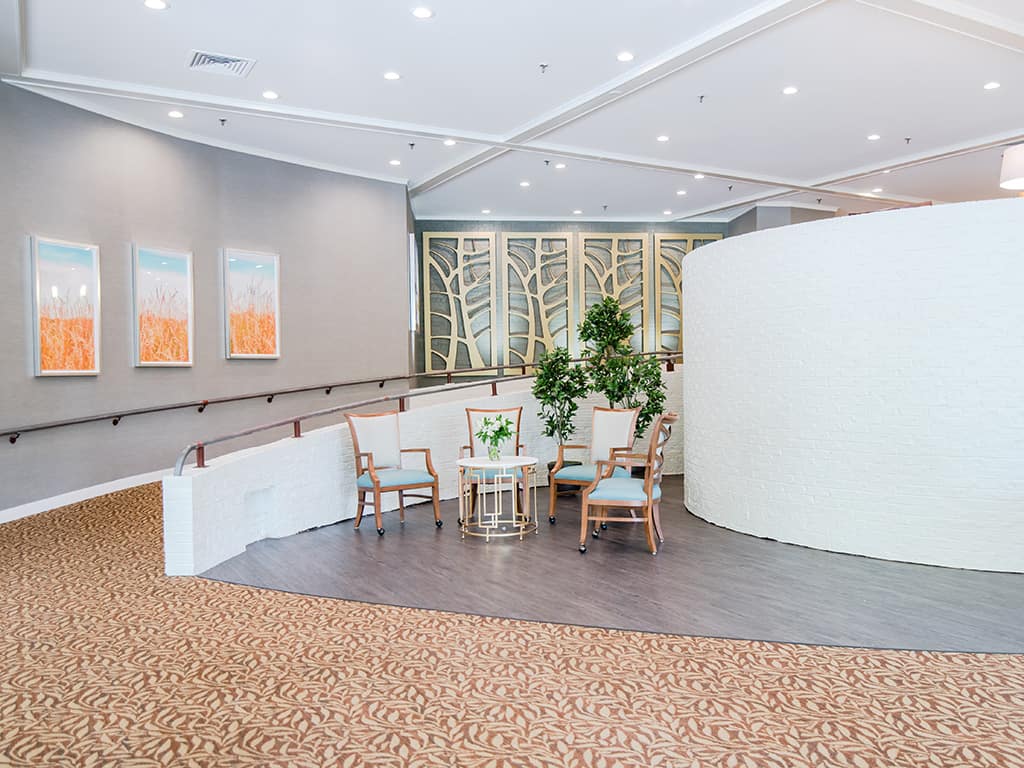 Bright interior common area with seating and plants