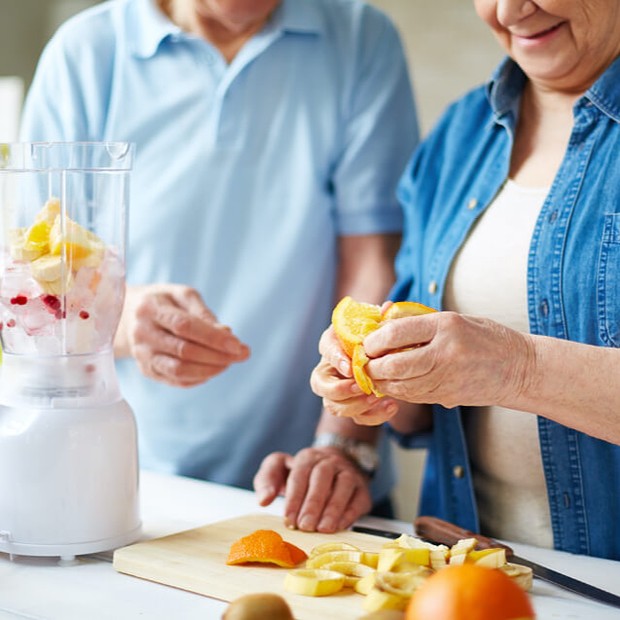 Residents preparing healthy smoothies in a kitchen