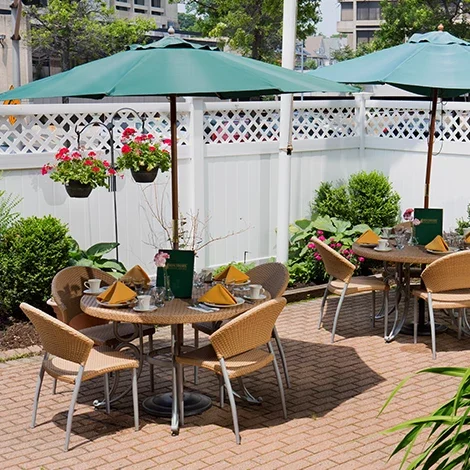 Outdoor dining area with tables and umbrellas