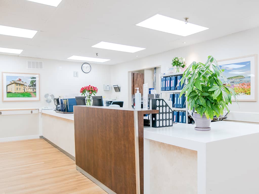 Reception area with a clean, modern design and natural light