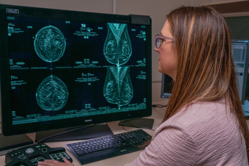 Medical professional analyzing mammogram images