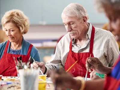 Residents participating in a painting activity