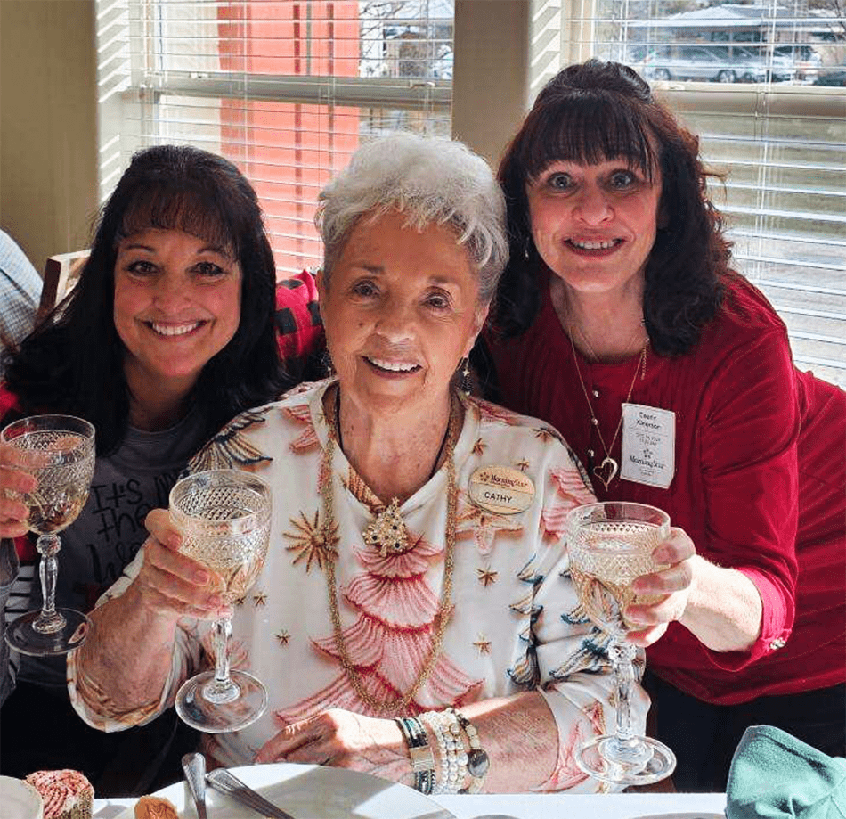 Residents and staff celebrating with drinks