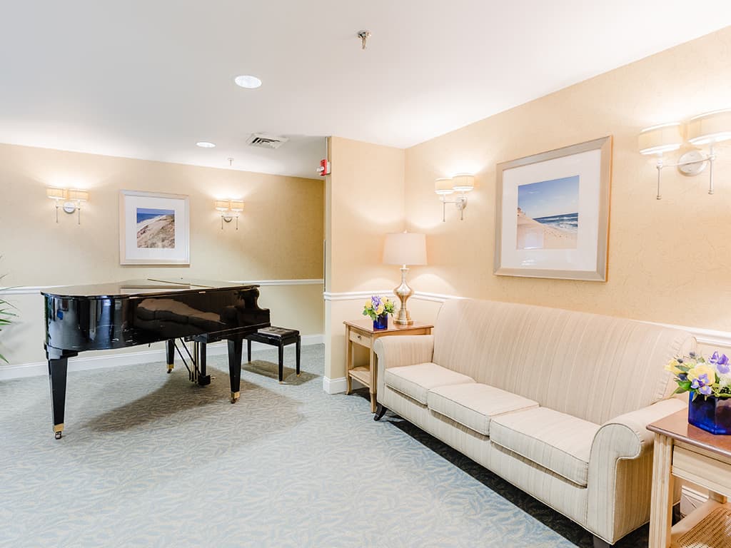 Interior common area with piano and seating