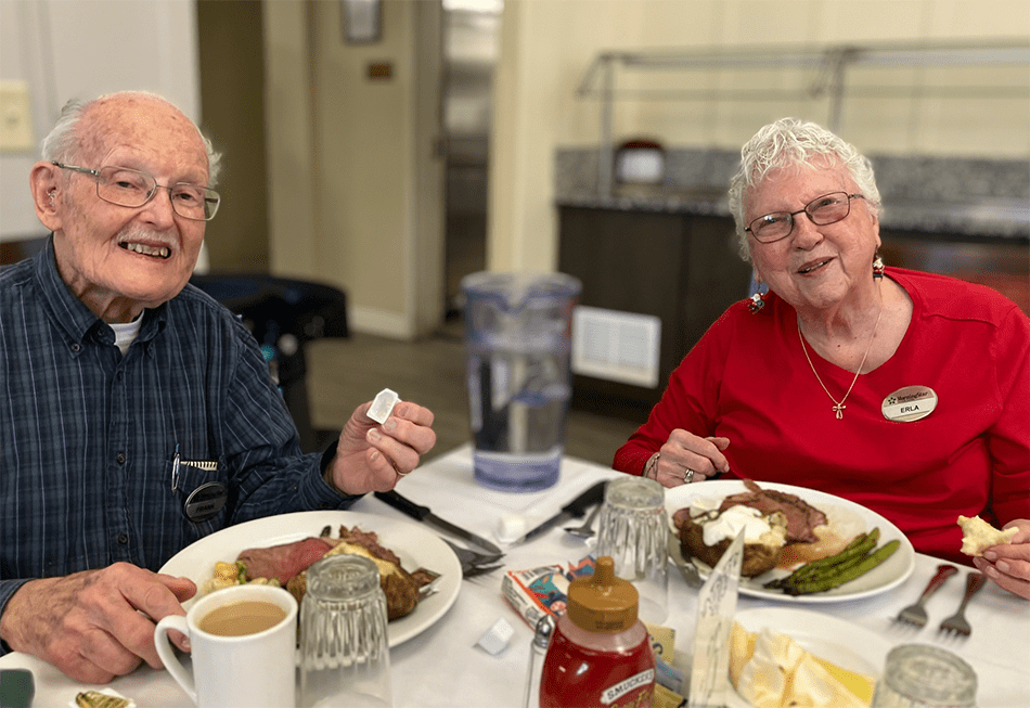 Residents enjoying a meal in the dining room