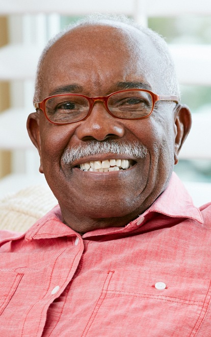 Close-up portrait of a smiling elderly man