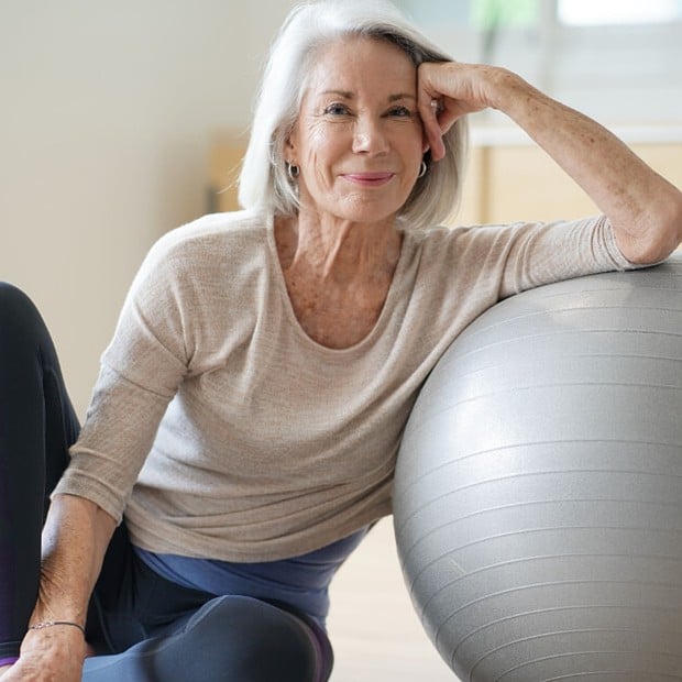 Senior woman exercising with a stability ball