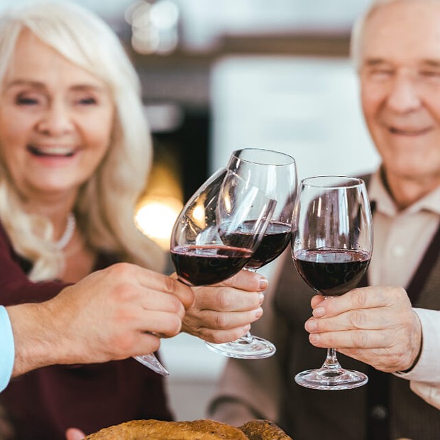 Residents toasting with wine glasses in celebration