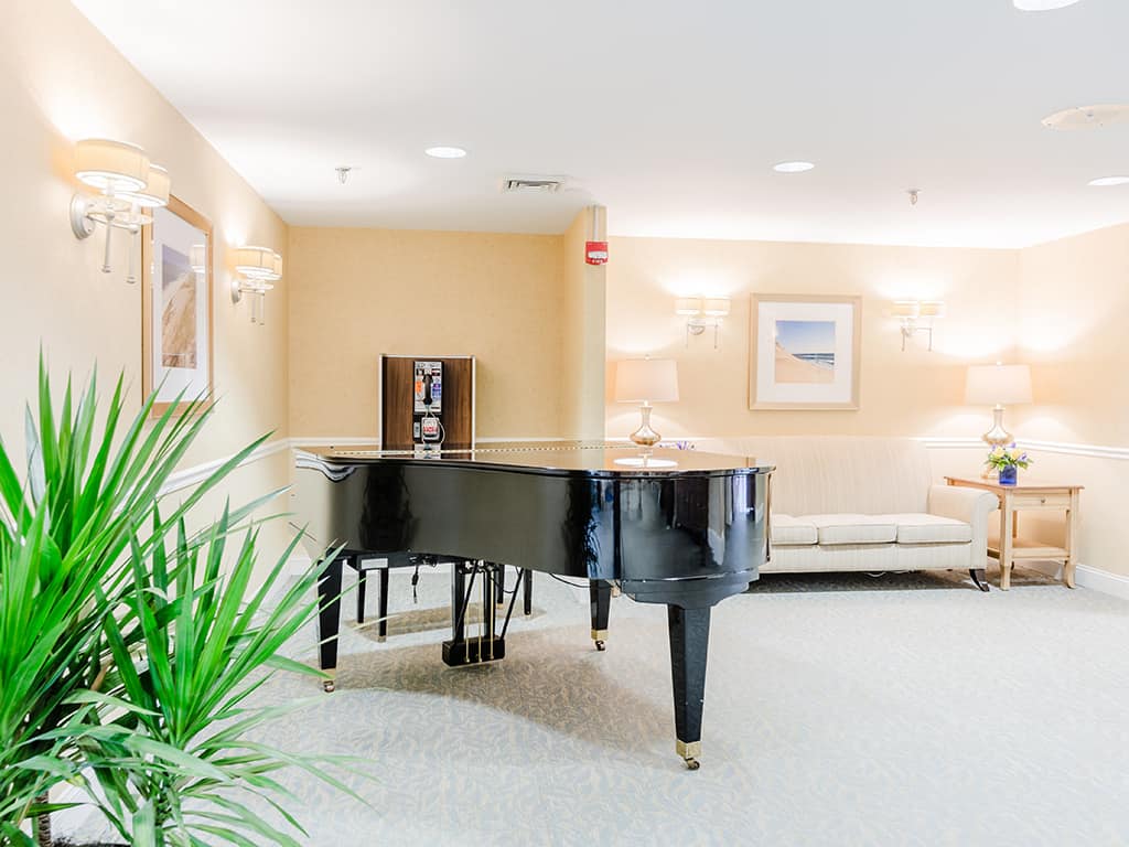 Interior view of a lounge area with a piano
