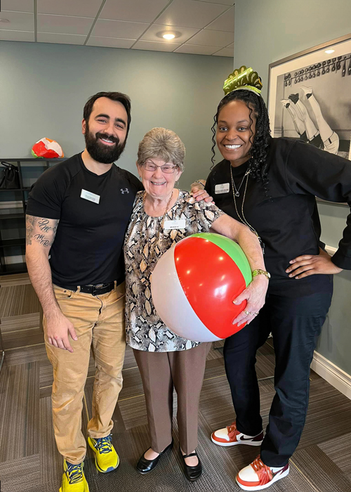 Residents and staff engaging in a fun activity indoors