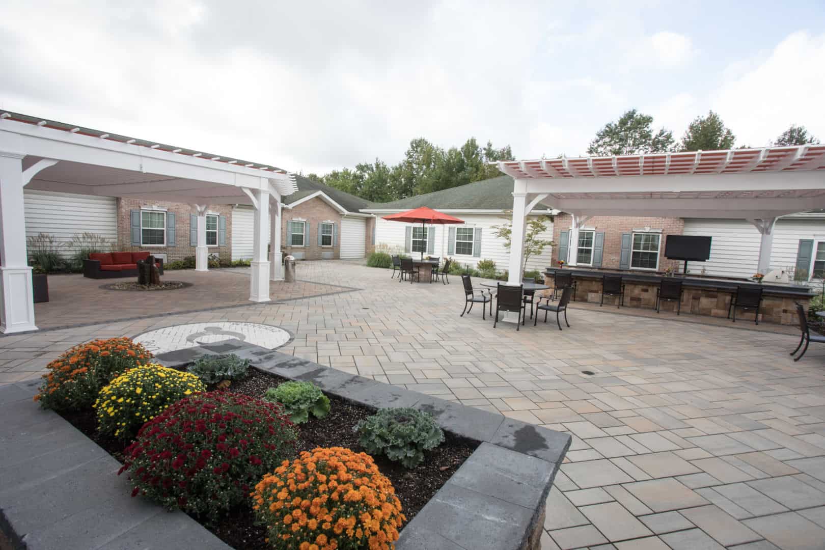 Outdoor courtyard with flowers and seating areas